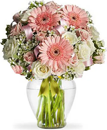 Roselline, Gerbere e Lisianthus con Fiori Misti dalle Tonalità Pastello e Verde Decorativo. Esprime Amicizia, Affetto e Purezza. Adatto per occasioni come Compleanni, Amicizia, Amore, Felicitazioni, Matrimoni, Nascita, Anniversari e Inaugurazioni.