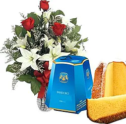 3 rose rosse e gigli o lilium dai toni chiari con pandoro