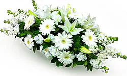 Cuscino funebre di gerbere, gigli o lilium e fiori misti dai toni chiari
